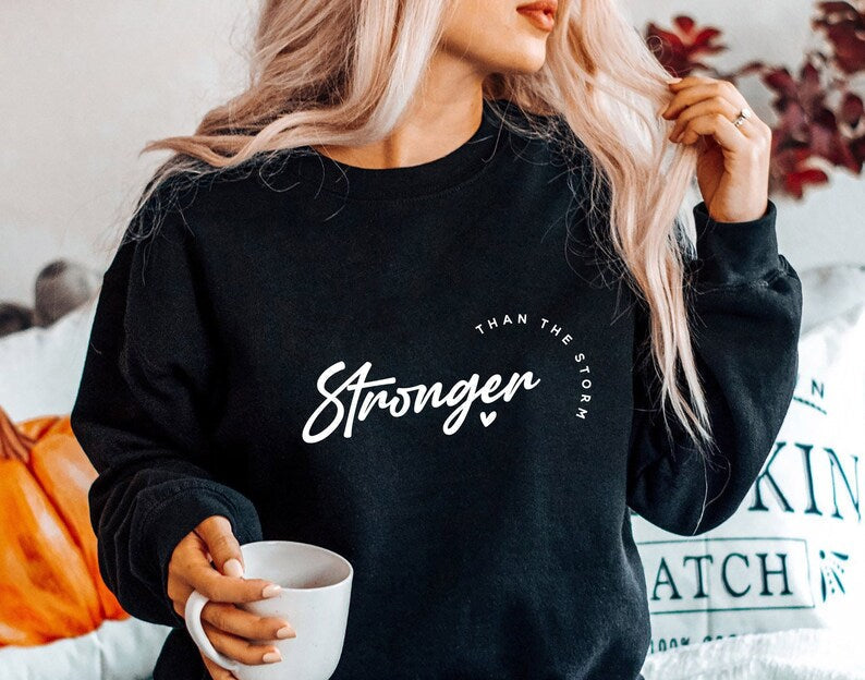 STRONGER THAN THE STORM sweatshirt