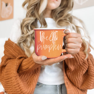 pumpkin orange ceramic mug for hot drinks
fall aesthetic mug with cozy vibes
warm orange mug for pumpkin spice latte
autumn morning coffee cup by window