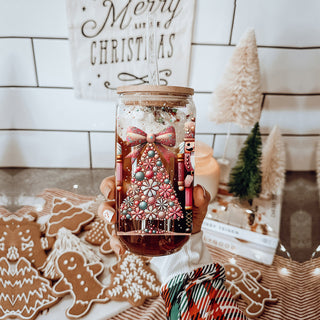Sparkly Christmas coffee tumbler – boho Nutcracker soldiers and tree design
Holiday coffee bar decor – glass cup with Christmas tree, bow, floral accents, and glitter