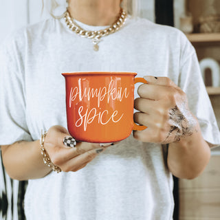 fall and halloween drinkware for her
seasonal orange ceramic mug for decor
autumn aesthetic mug for instagram photos
cozy fall mornings coffee cup by window
halloween mug for witchy fall vibes