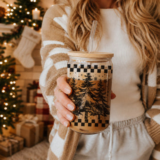 winter tree holiday tumbler
evergreen forest Christmas cup
snowflake and tree glass tumbler
checkered border Christmas tumbler
