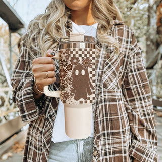 Retro spooky tumbler with checkered pattern and flowers

40oz fall tumbler with ghost, skull, and floral design

Neutral autumn tumbler with vintage checkered wrap

Cute spooky 40oz insulated tumbler for fall

Retro Halloween tumbler with ghost and skull artwork