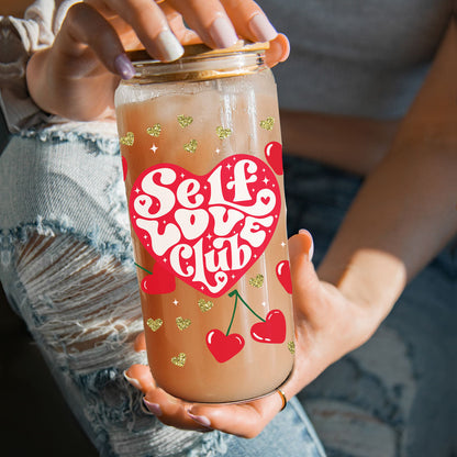 Cute 20oz glass cups with bamboo lid, glass straw, and glittering gold hearts for a self-love gift.
20oz glass cups with bamboo lid, glass straw, and retro font "Self Love Club" for Valentine’s Day.