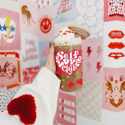 20oz glass cups with bamboo lid and glass straw featuring Self Love Club and red heart cherry graphics for empowering gifts.
Inspirational 20oz glass cups with bamboo lid and glass straw, perfect for women’s empowerment and self love.