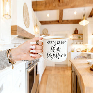 novelty gift mug for stressed friend
large handle ceramic mug for long days
realistic life struggle coffee cup
funny mug for people who do it all
cute but honest adult humor coffee mug
comforting sarcasm mug for morning coffee
lifestyle photo of woman holding funny mug