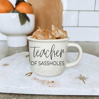 funny mug for special education teacher
unique teacher appreciation week gift mug
teacher of sassholes mug on white background
closeup of teacher of sassholes mug text
woman holding teacher of sassholes coffee mug
funny teacher mug for staff room wholesale